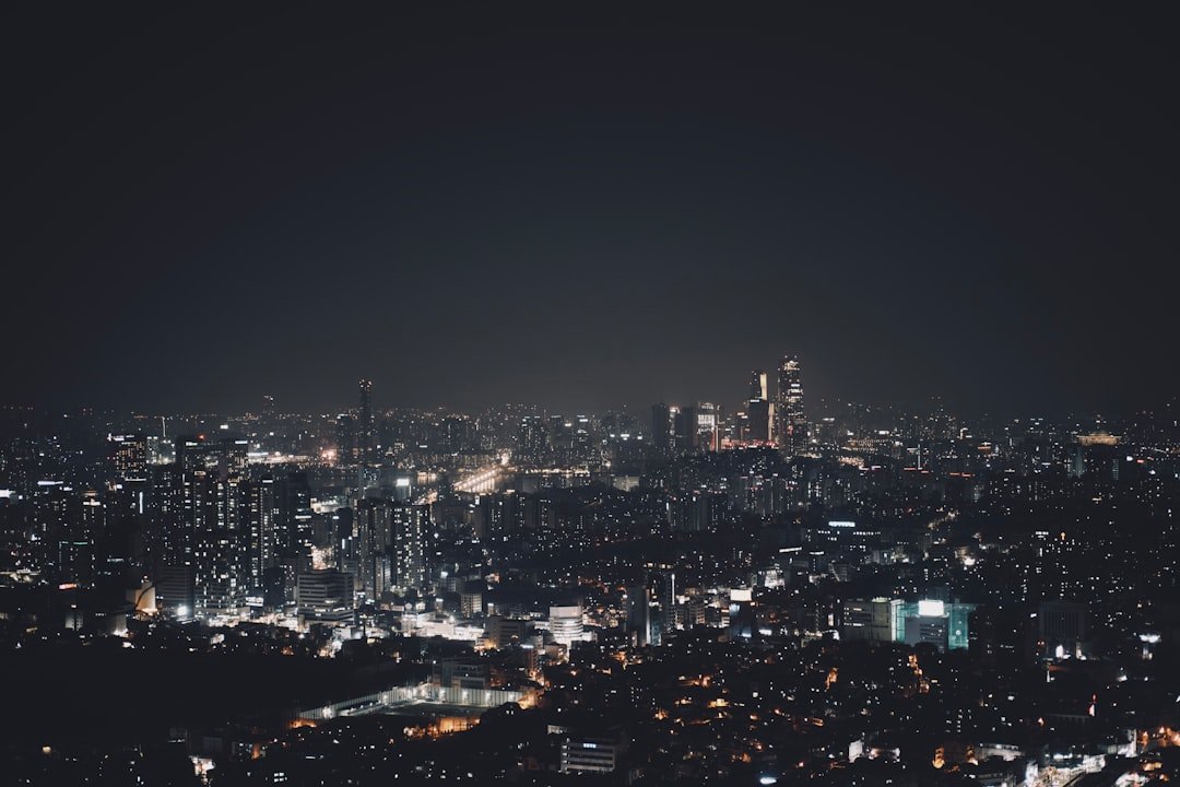 Dark city skyline at night for a dark romance books reading guide
