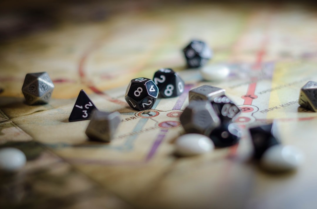 Dice on a wooden table for a progression fantasy and LitRPG reading hub